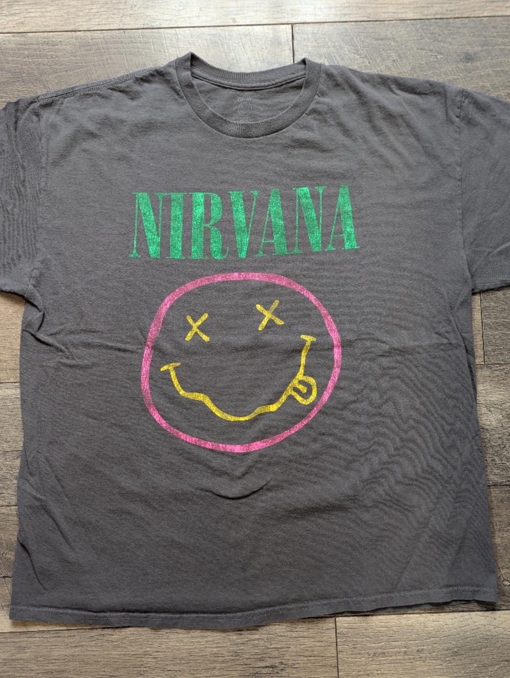 NIRVANA Black Tee with Green Logo and Pink-Yellow Smiley Graphic